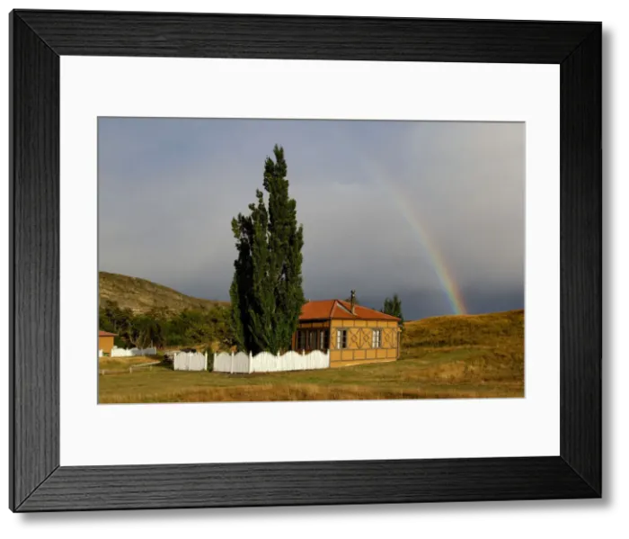 Framed Print : Estancia. South America; Chile; Patagonia; Torres del Paine, house with rainbow