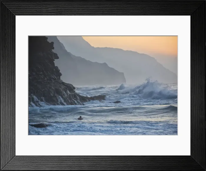 Framed Print : Kauai. USA, Hawaii, Kauai, Hanalei:Haena State Park, ke e beach, surfer at Na Pali coast