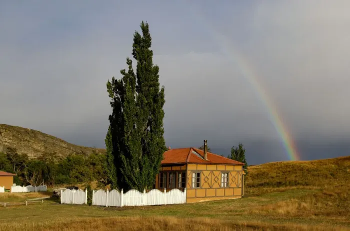 Framed Print : Estancia. South America; Chile; Patagonia; Torres del Paine, house with rainbow